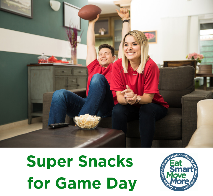 couple watching football game on couch with popcorn