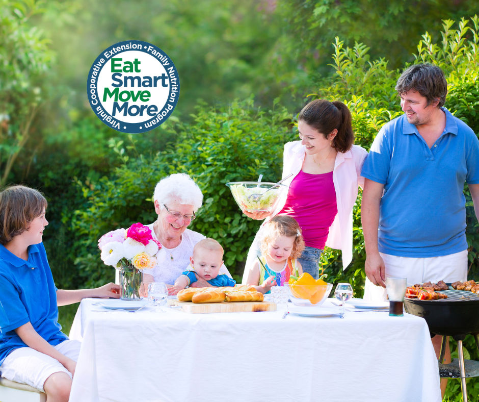 multigenerational family grilling out and eating outdoors